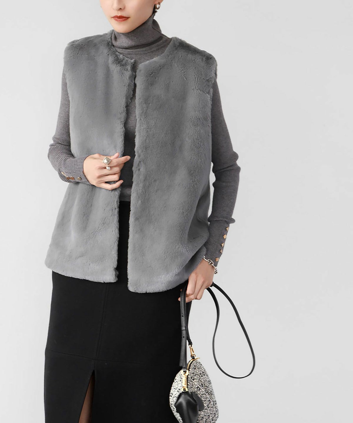 Charcoal turtleneck with faux fur vest